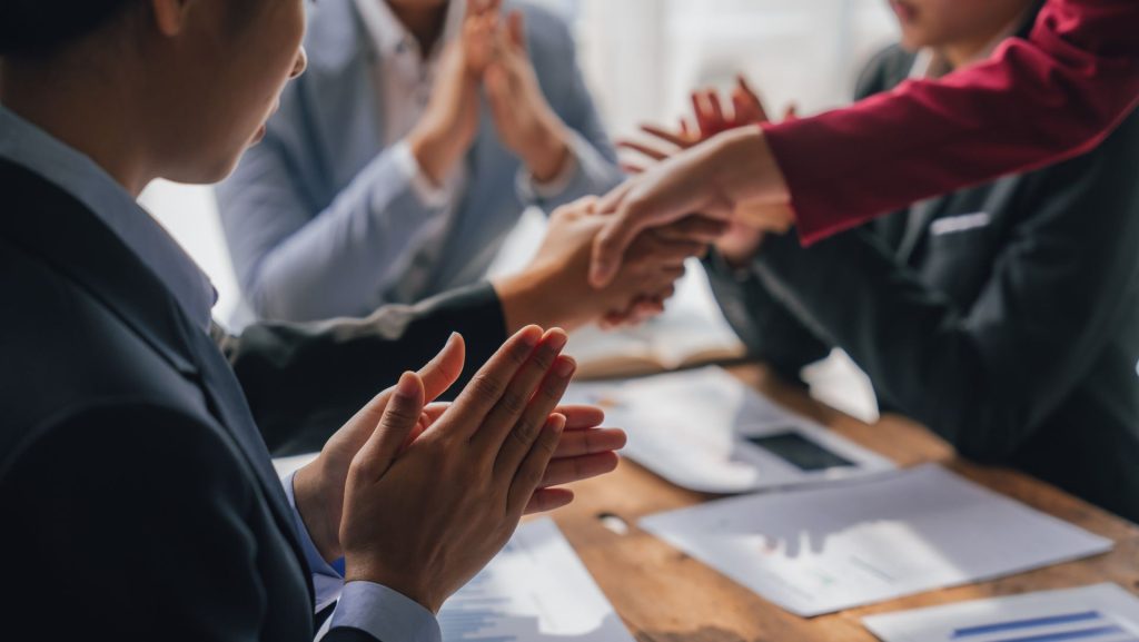 Professionals shaking hands with each other